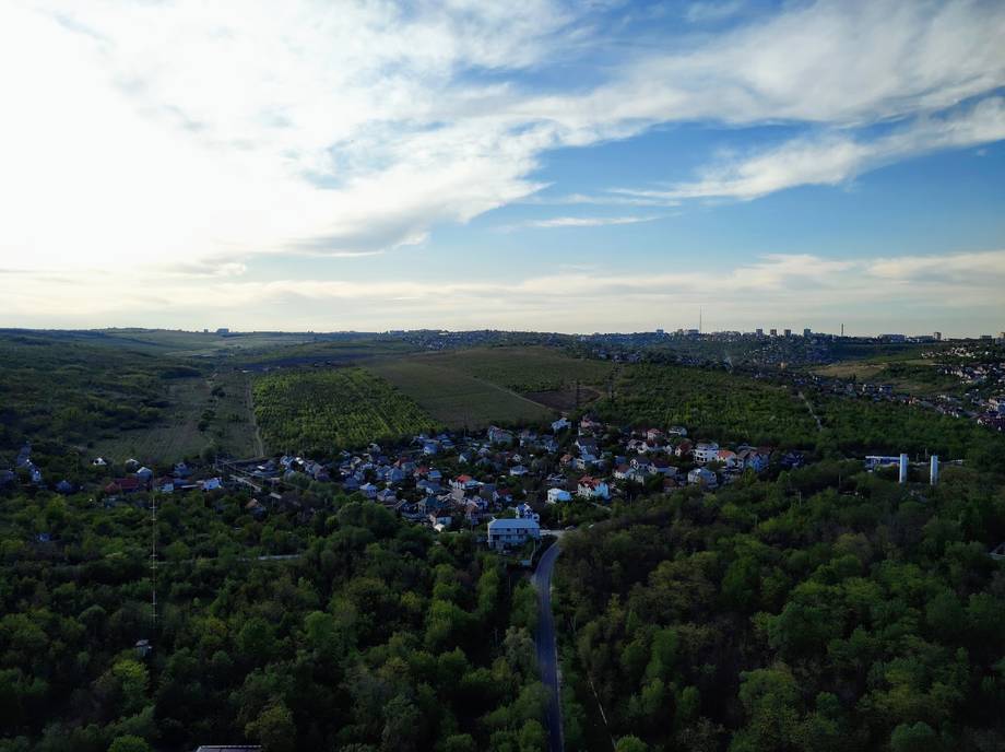 Aerial view of Moldova countryside with green hills and scattered settlements