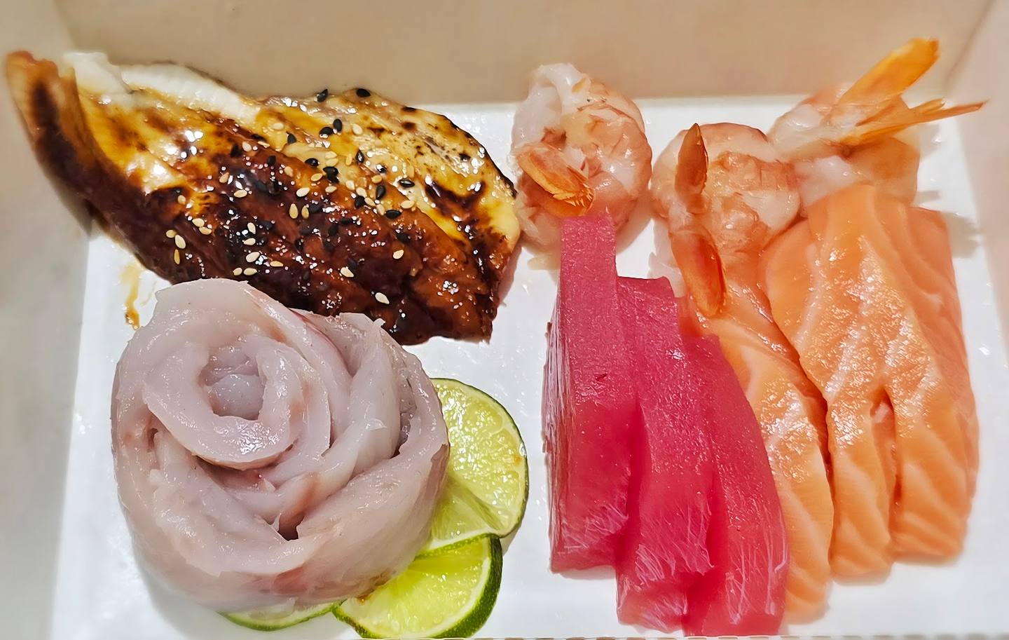 Assorted sashimi and grilled eel platter with cucumber and wasabi