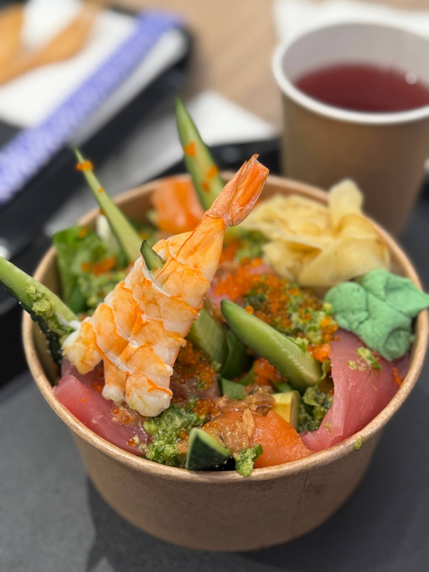 Gourmet seafood bowl with shrimp, fresh vegetables and garnish
