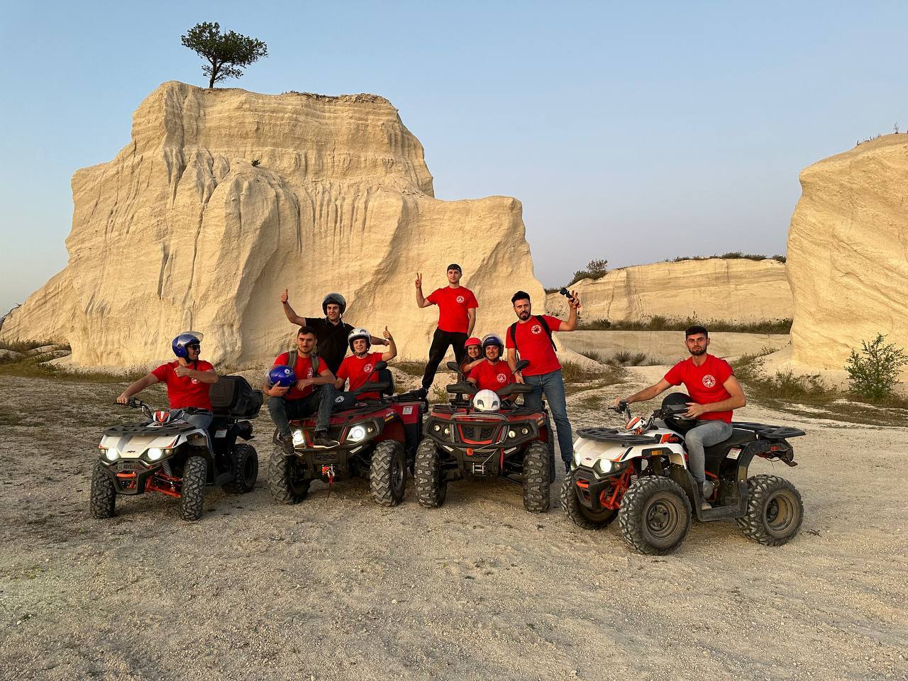 ATV group tour with riders in front of iconic limestone formations