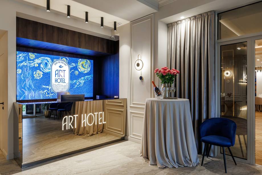 Art Hotel lobby entrance with branded reception desk and modern interior design