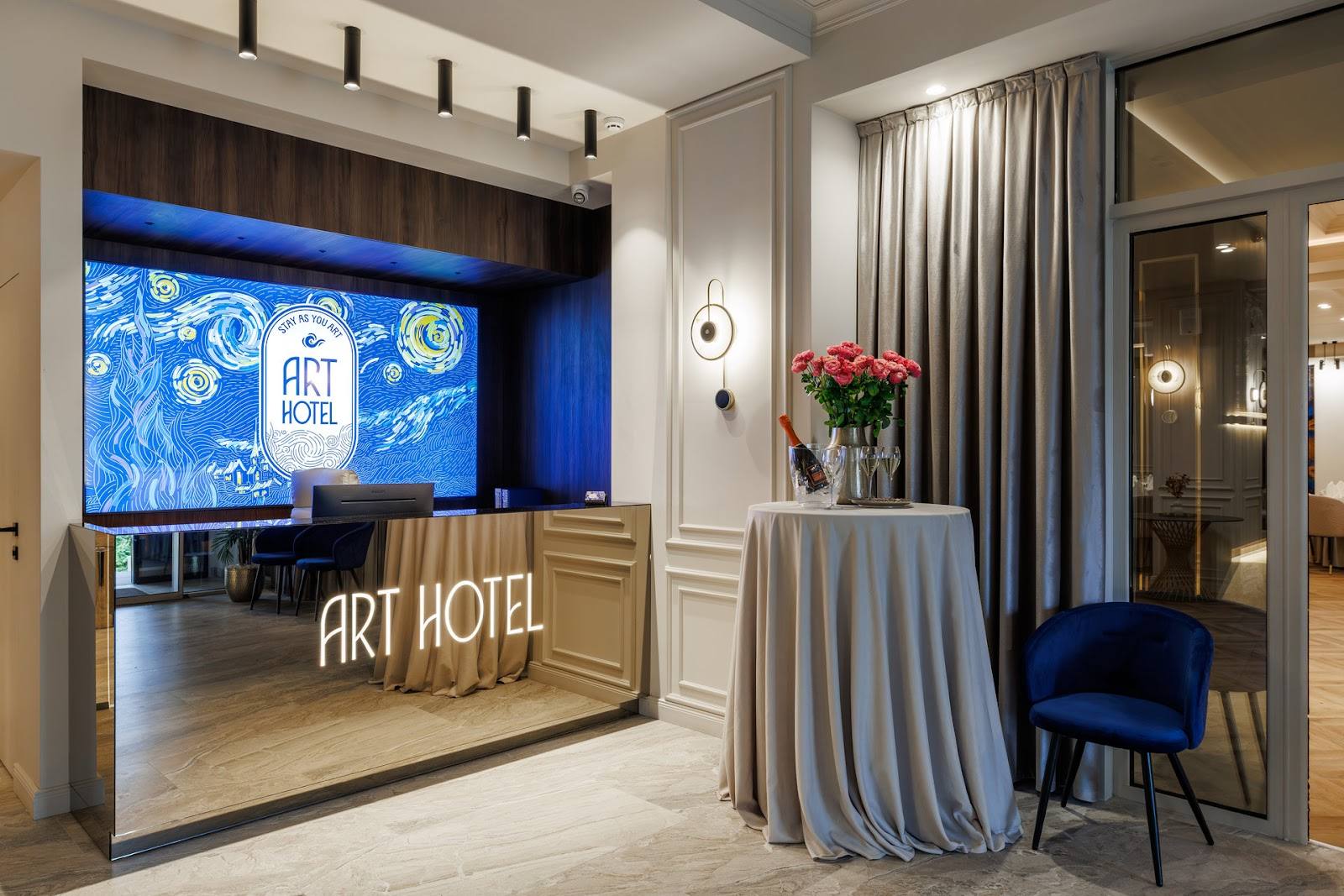 Art Hotel lobby entrance with branded reception desk and modern interior design