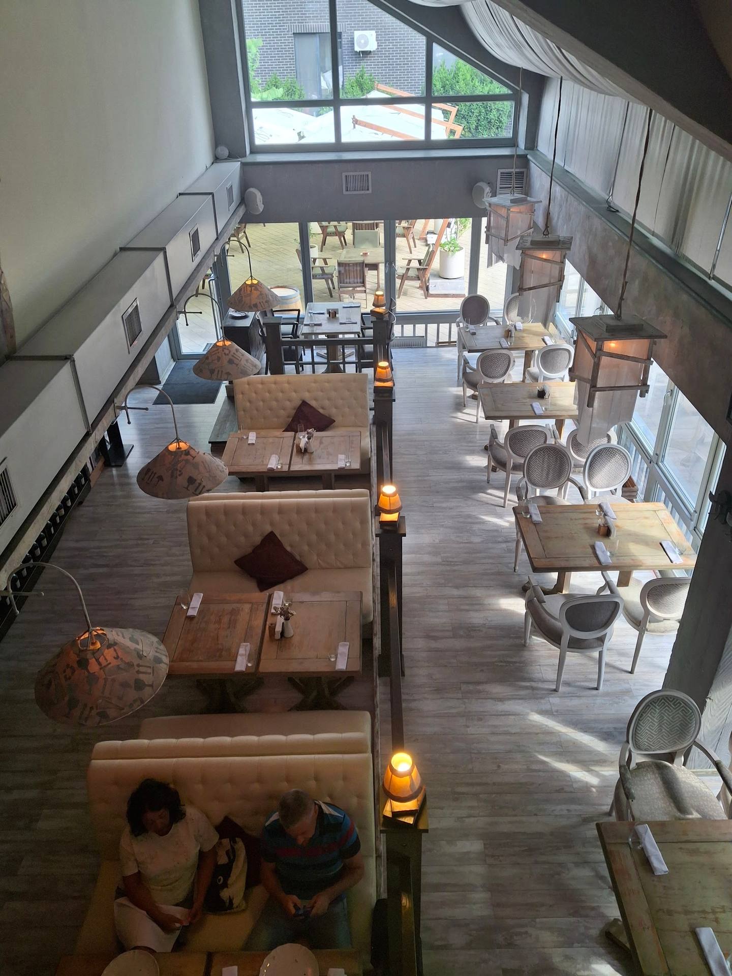 Modern multi-level lounge interior with contemporary furniture and natural daylight