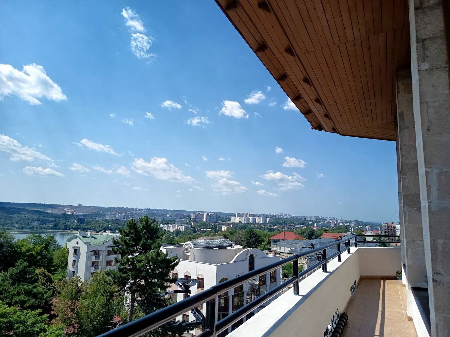 Panoramic city view from venue terrace overlooking residential neighborhoods