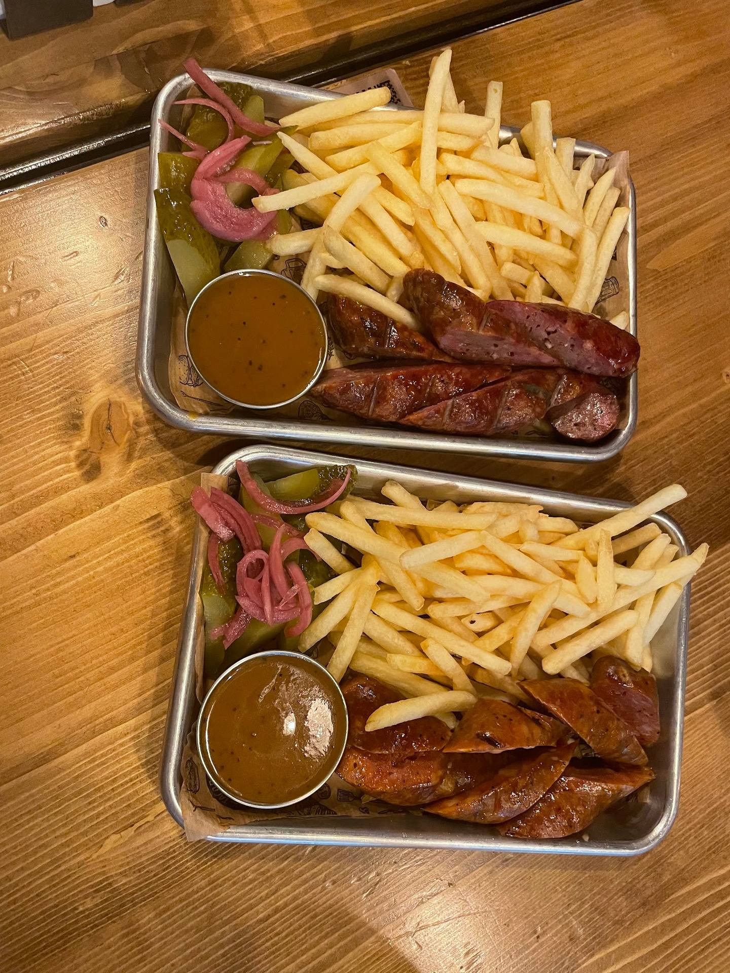Charcuterie plates with fries, pickled onions, and dipping sauce