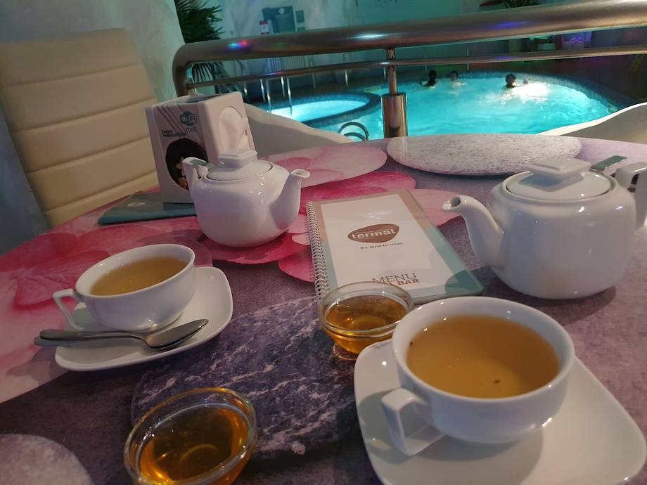 Tea service at the spa wellness pool overlooking the indoor aquatic area