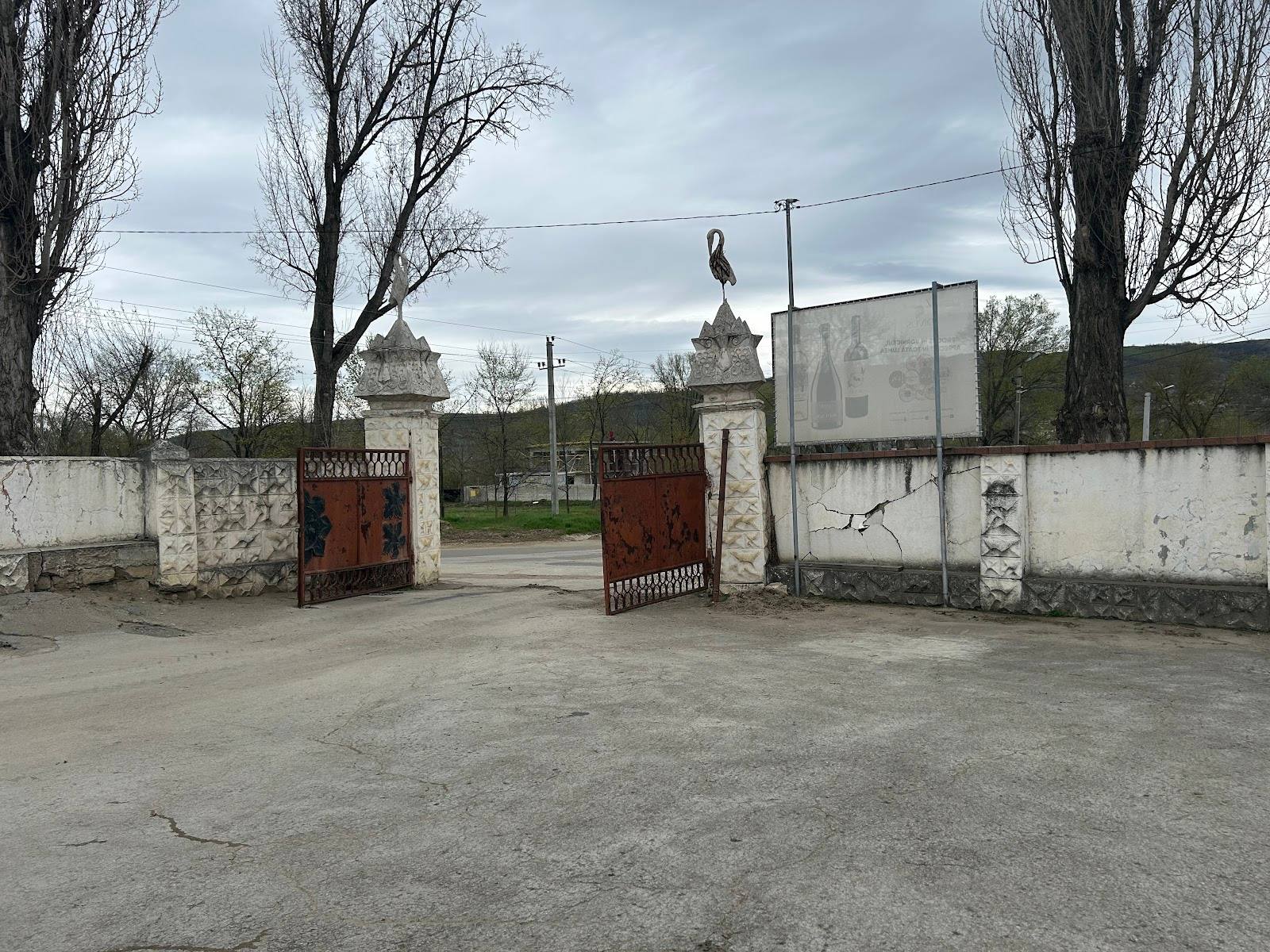 Historic monastery entrance with ornate gates and bell towers visible