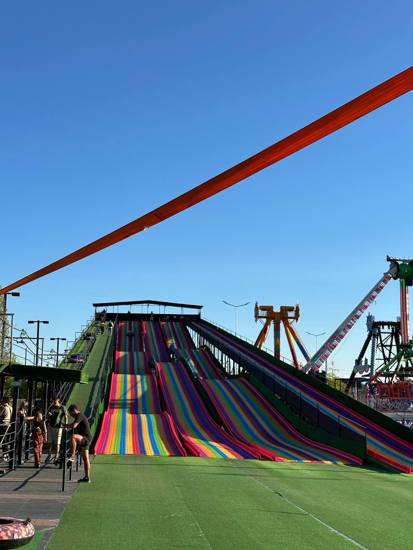 Colorful water slides and amusement park rides in daylight