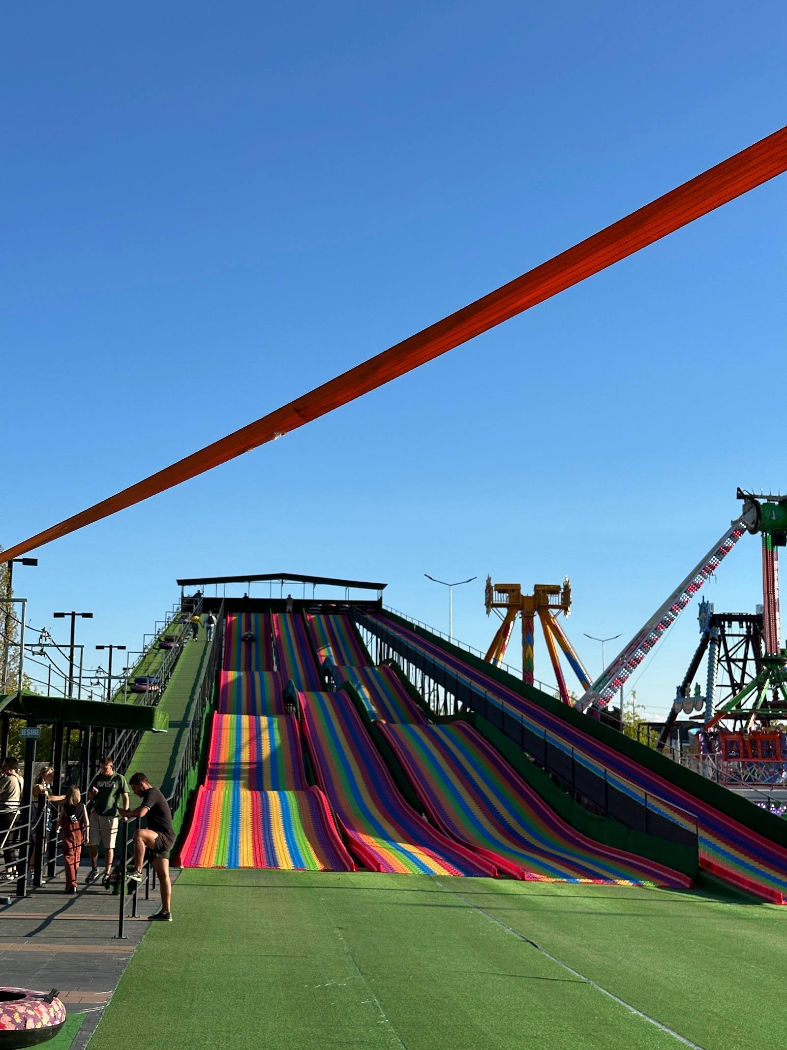 Colorful water slides and amusement park rides in daylight