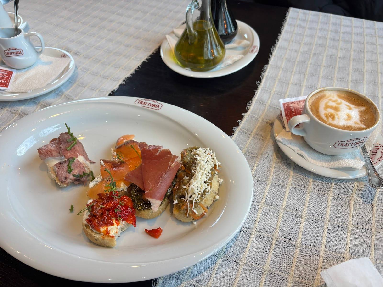Plated appetizers and cappuccino at a contemporary cafe restaurant