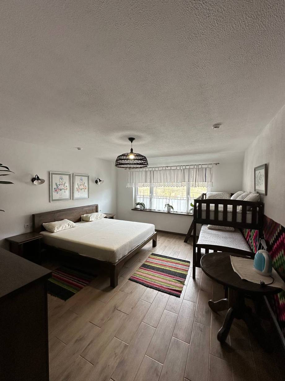 Residential bedroom with bed and crib, not a venue space