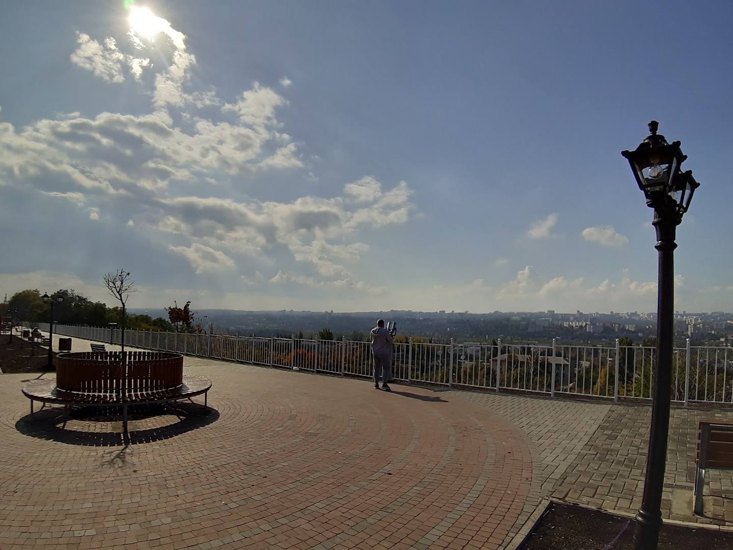 Panoramic terrace overlook with seating area and mountain vista