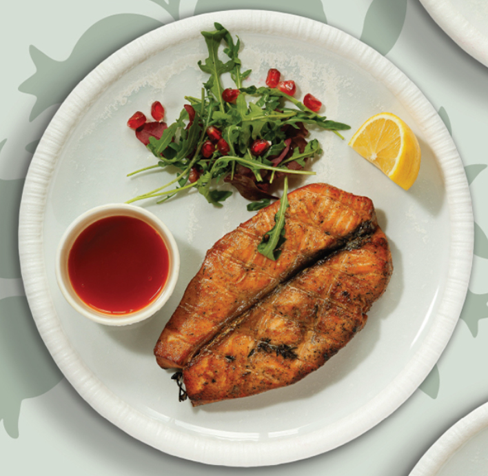 Grilled salmon fillet with microgreens salad and citrus sauce