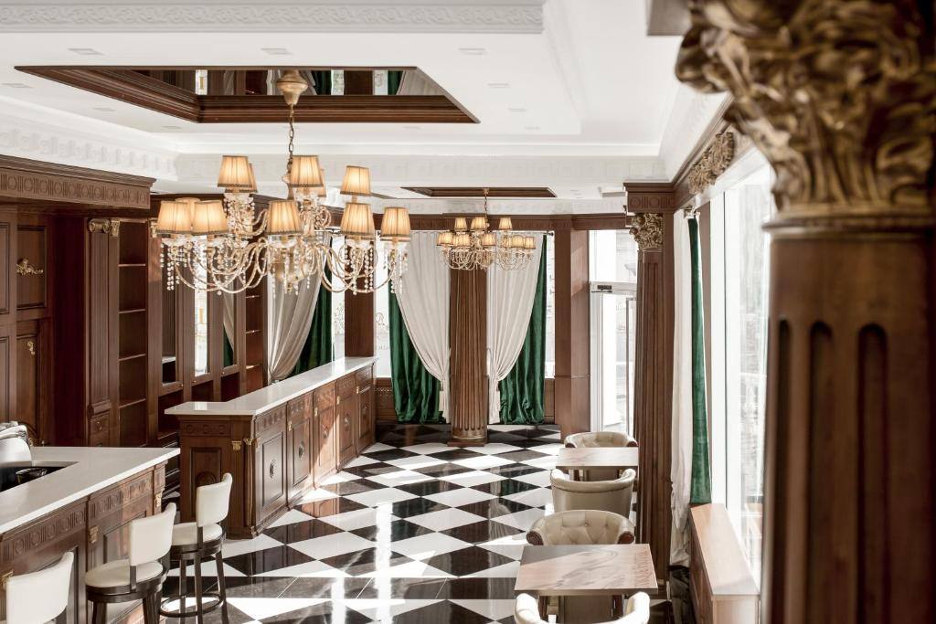 Elegant spa or wellness reception area with marble flooring and crystal chandeliers