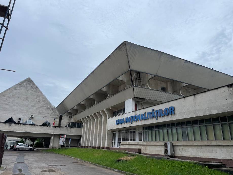 Soviet-era modernist venue building with blue signage and distinctive brutalist architecture