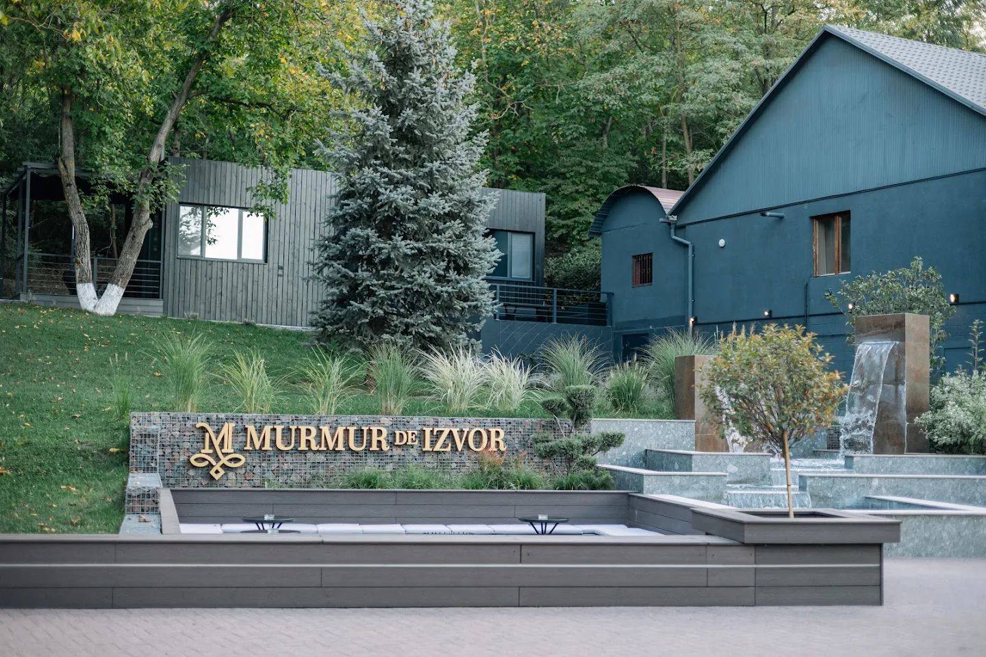 M. Murmure winery entrance with signage and blue architecture building