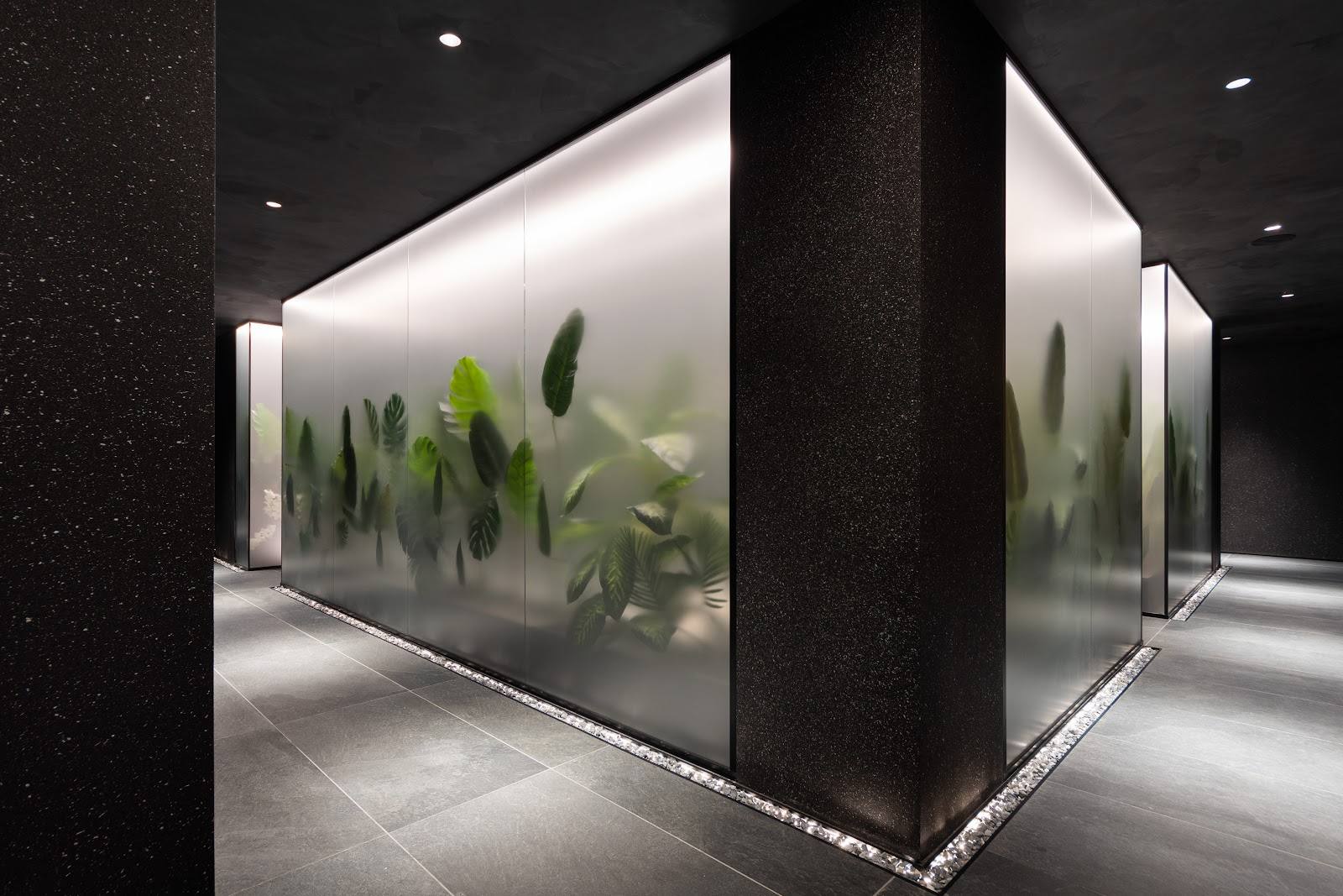 Modern botanical display with architectural lighting and minimalist columns