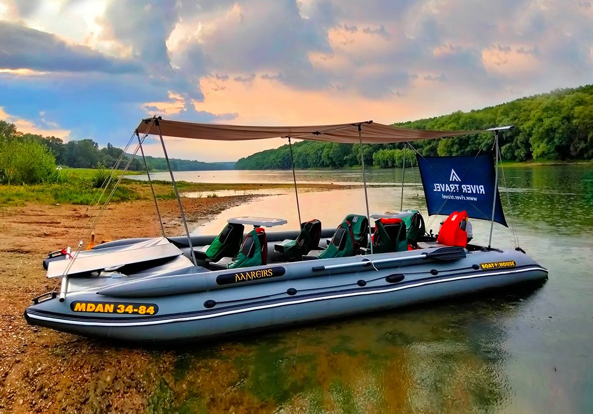 River speedboat tour with canopy shade and passenger seating on Dniester River