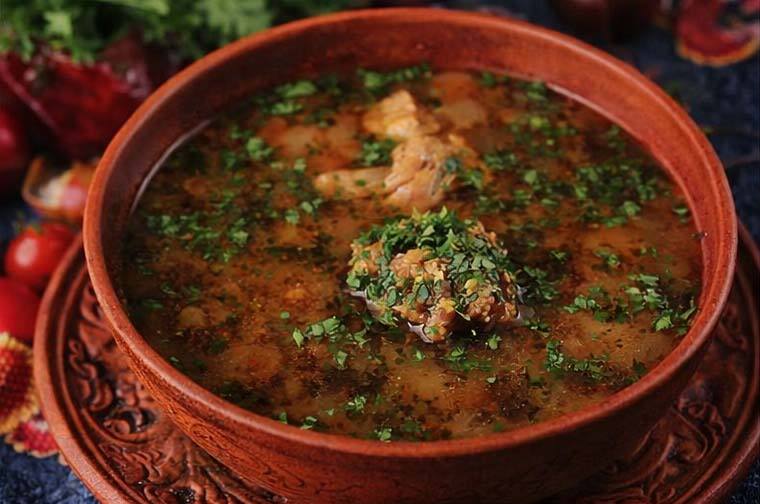 Traditional Moldovan soup in decorative ceramic bowl