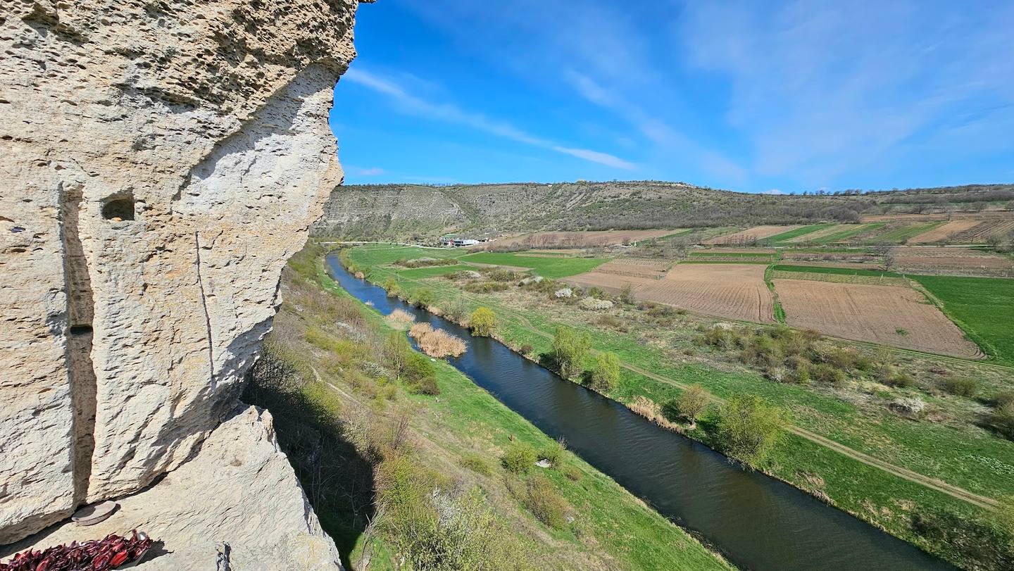 Fortress cliff overlook with river valley panorama and green landscape below