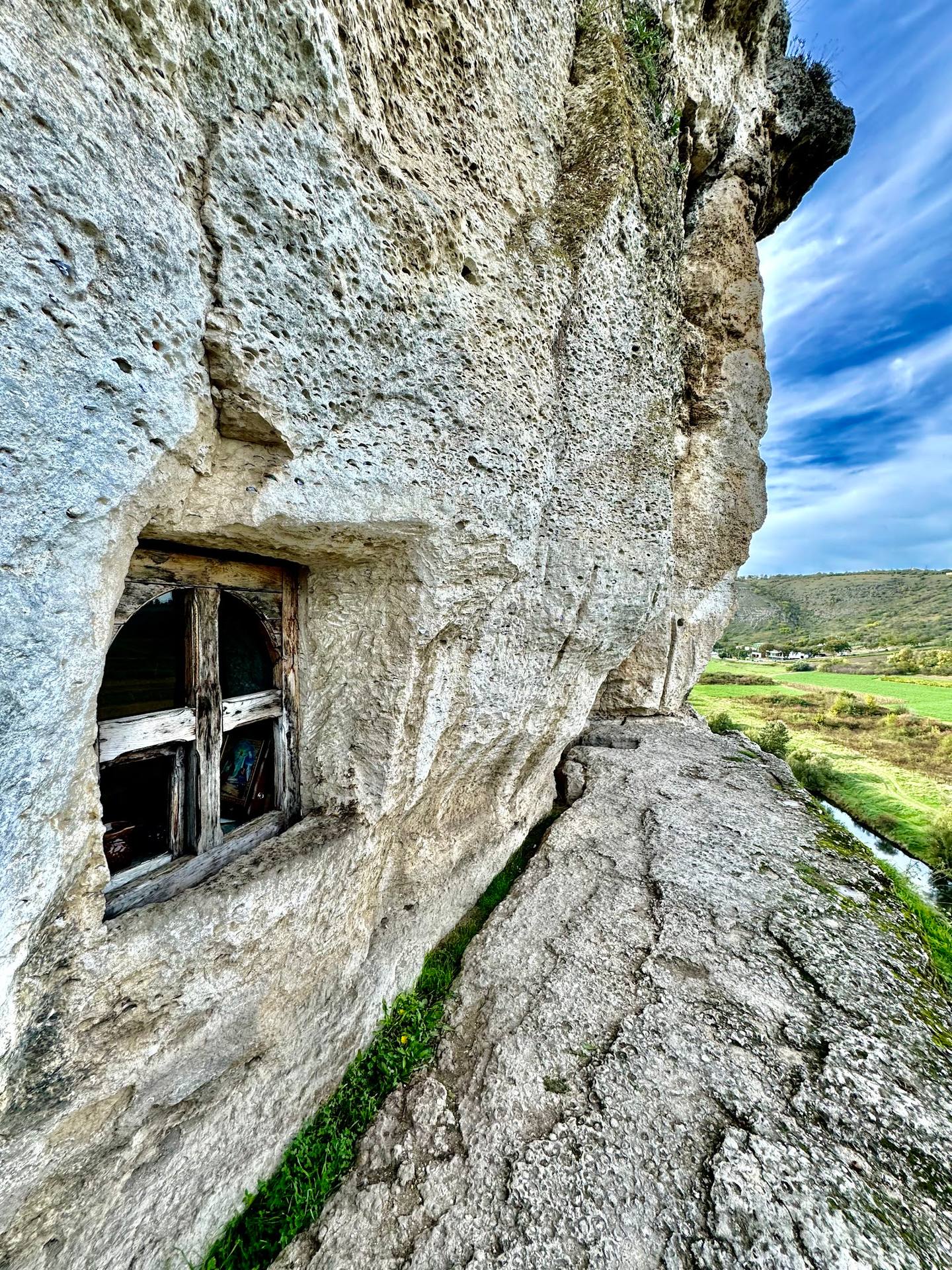 Historic stone fortress window with panoramic valley landscape view