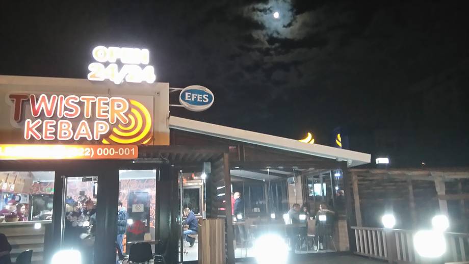 Twister Kebab storefront at night with illuminated signage and shop entrance