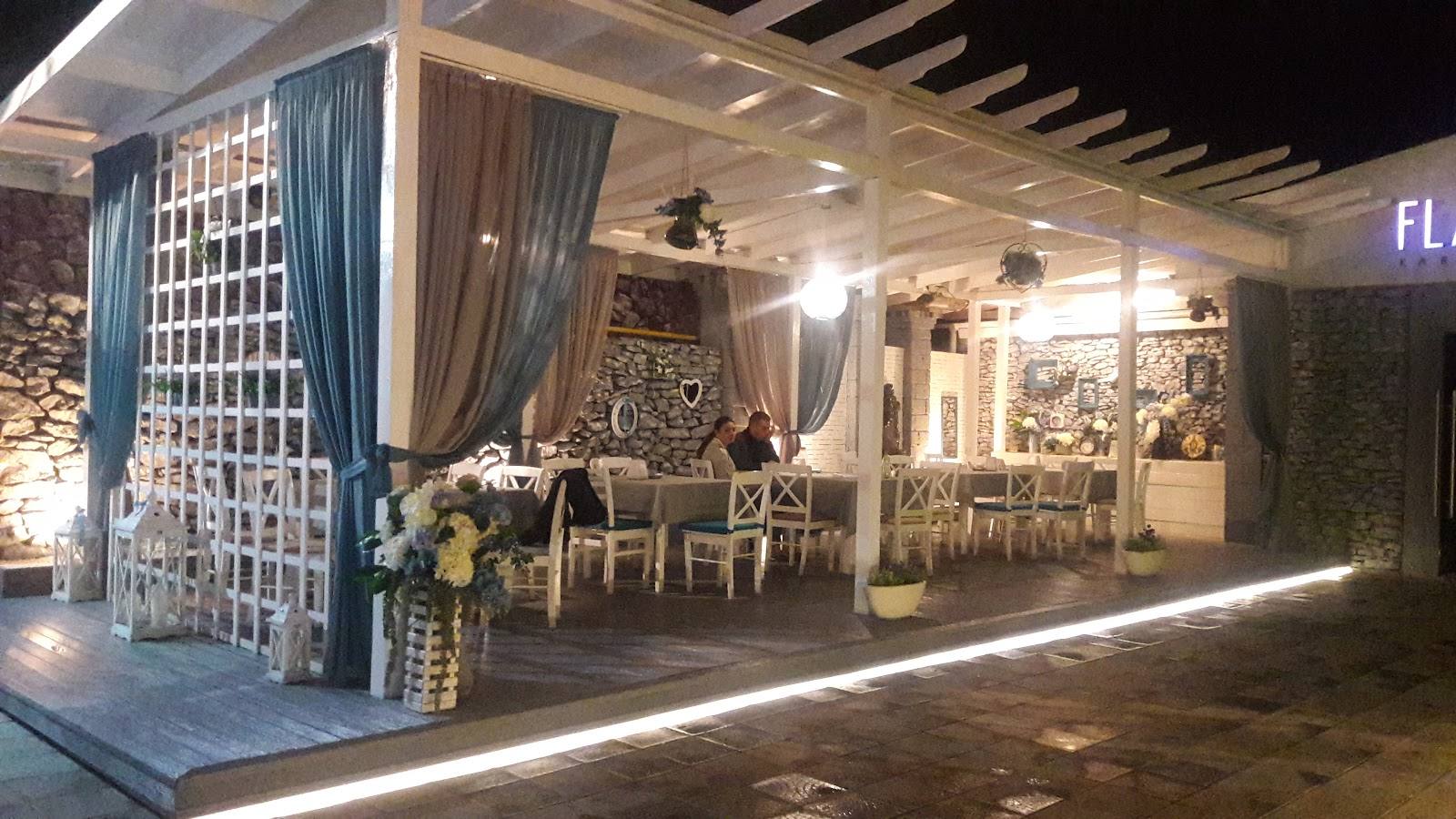 Event venue storefront with elegant facade, seating area, and ambient lighting at night