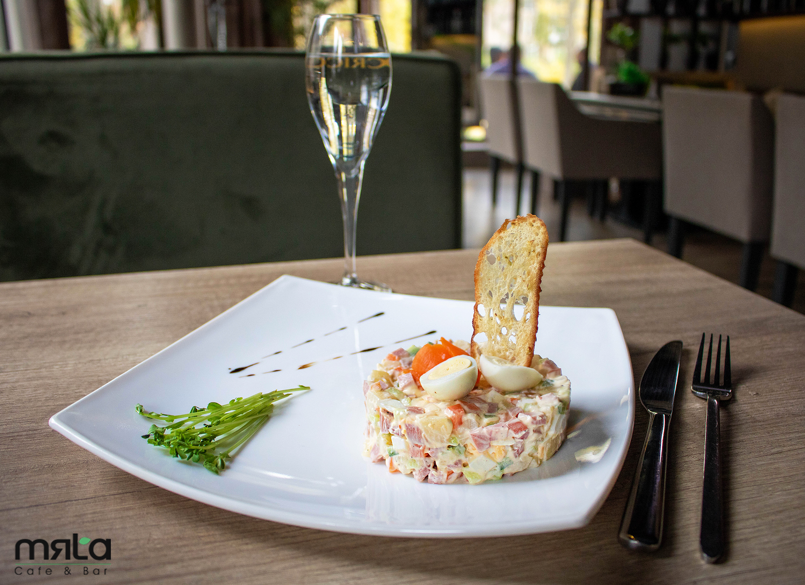 Plated seafood tartare with champagne and toast points