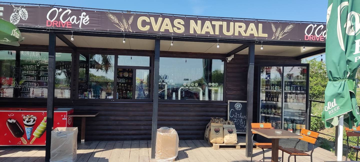 CVAS NATURAL storefront with covered terrace seating and signage