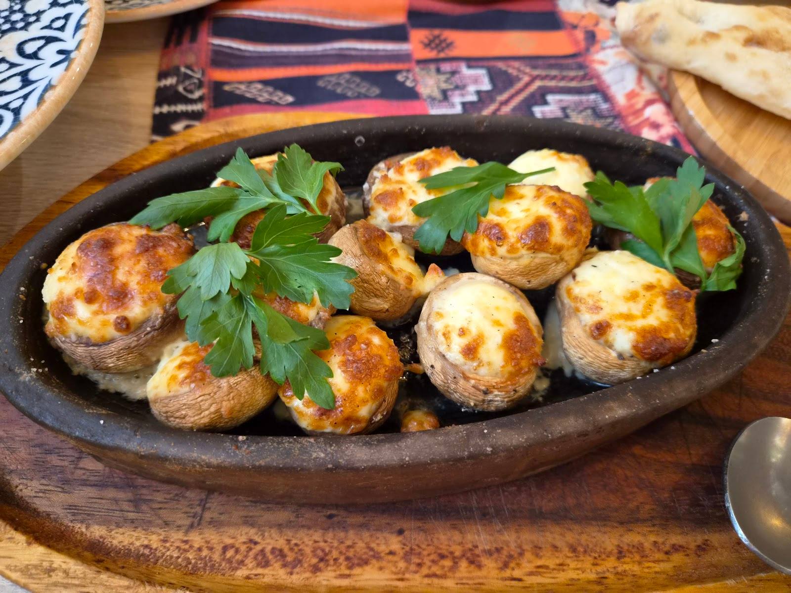 Meatballs in cast-iron skillet with fresh parsley garnish