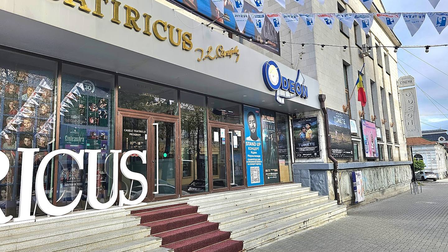 Modern storefront facade with signage and entrance steps in daytime