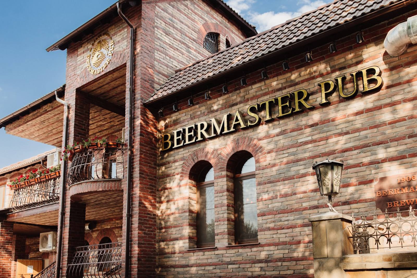 Beermaster Pub storefront with distinctive brick facade and signage