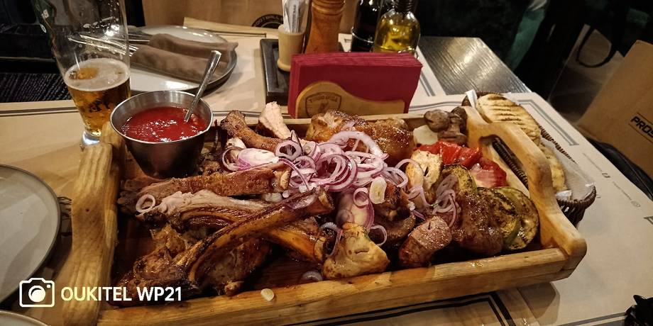 Charcuterie and cured meat board served with wine and sauce