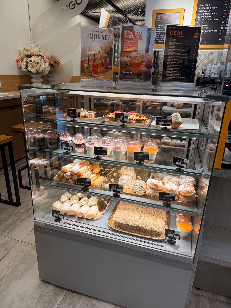 Bakery display case with pastries, cakes and baked goods