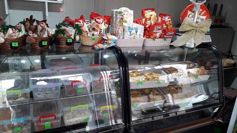 Pastry and dessert display counter with cakes and confections
