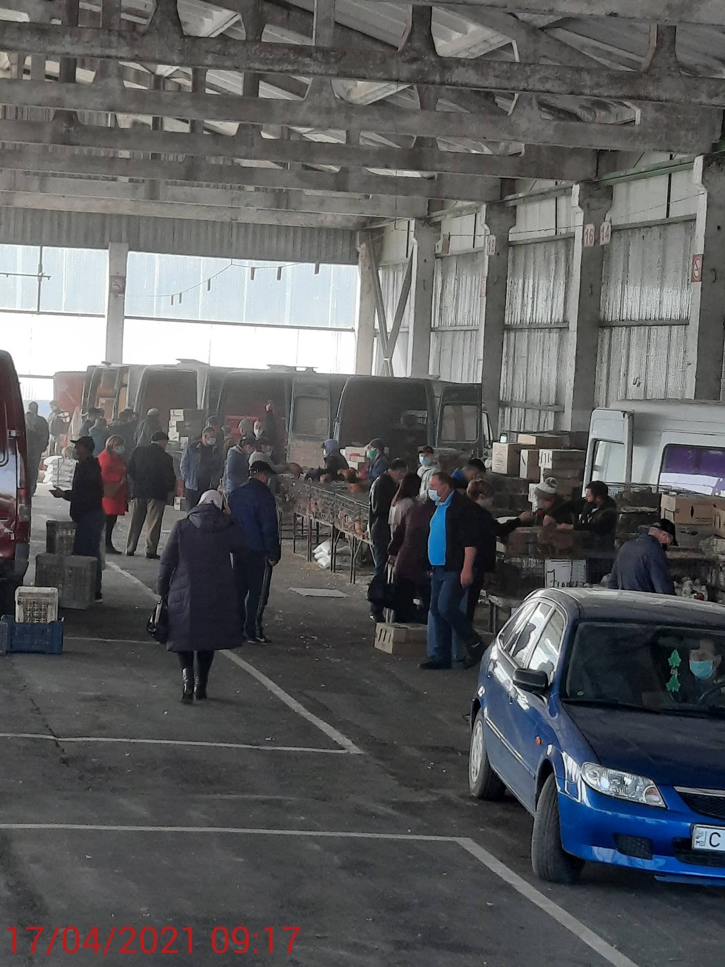 Spacious interior warehouse or service facility with exposed ceiling and multiple visitor stations
