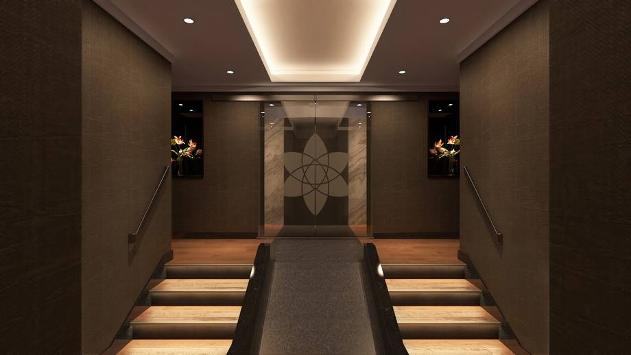 Symmetrical chapel interior with illuminated aisle, ornamental cross backdrop, and ambient ceiling lighting