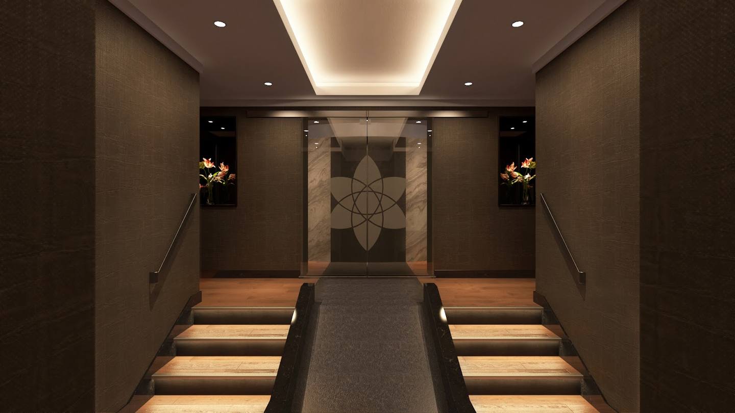 Symmetrical chapel interior with illuminated aisle, ornamental cross backdrop, and ambient ceiling lighting