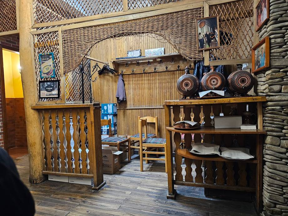 Rustic wooden interior with traditional crafts display and workshop setup