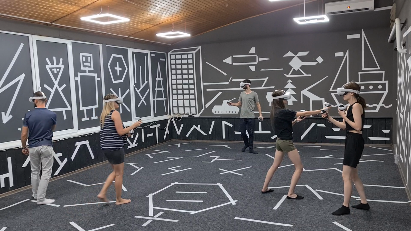 Functional training studio with dynamic circuit workout and geometric wall design
