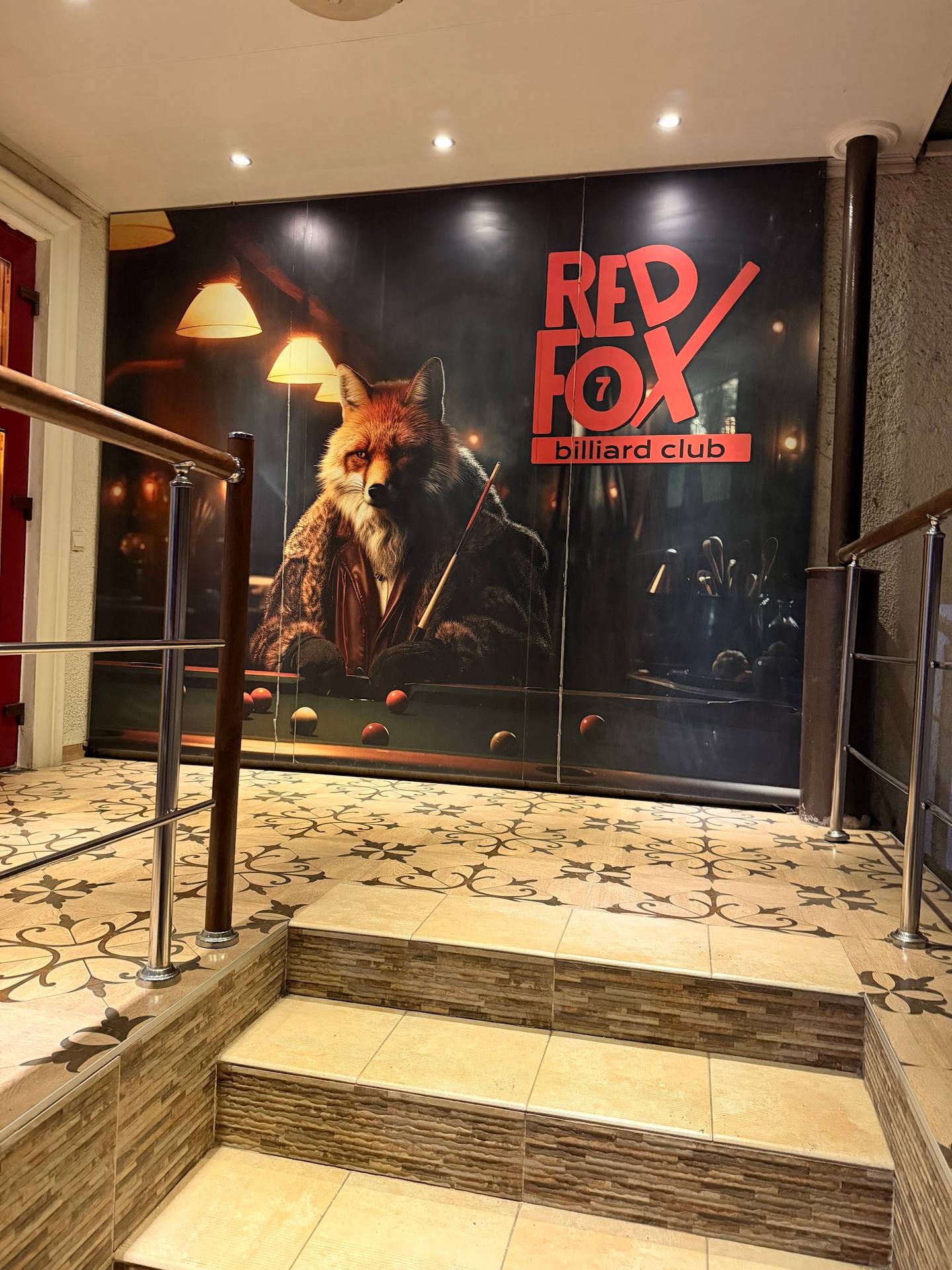Red Fox Billiard Club entrance with branding signage and interior passage