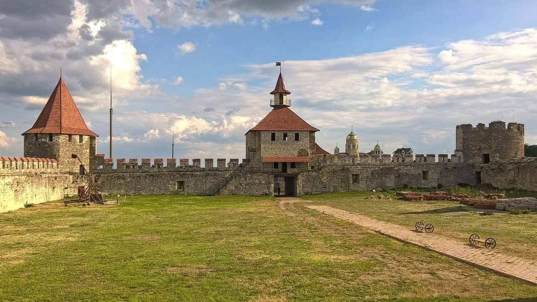 Medieval fortress interior courtyard with stone towers and crenellated walls