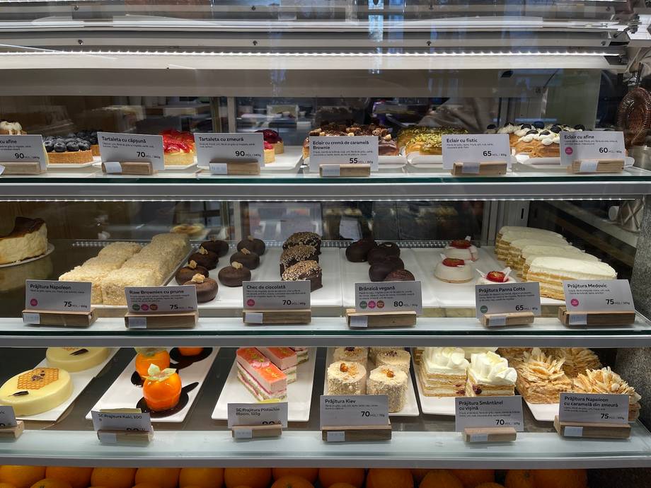 Bakery pastry display case with cakes, desserts and prepared items