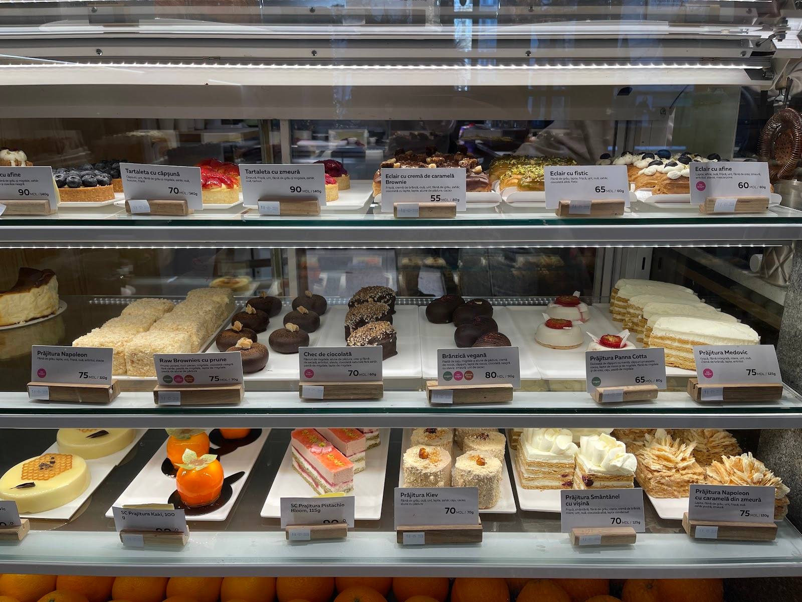 Bakery pastry display case with cakes, desserts and prepared items