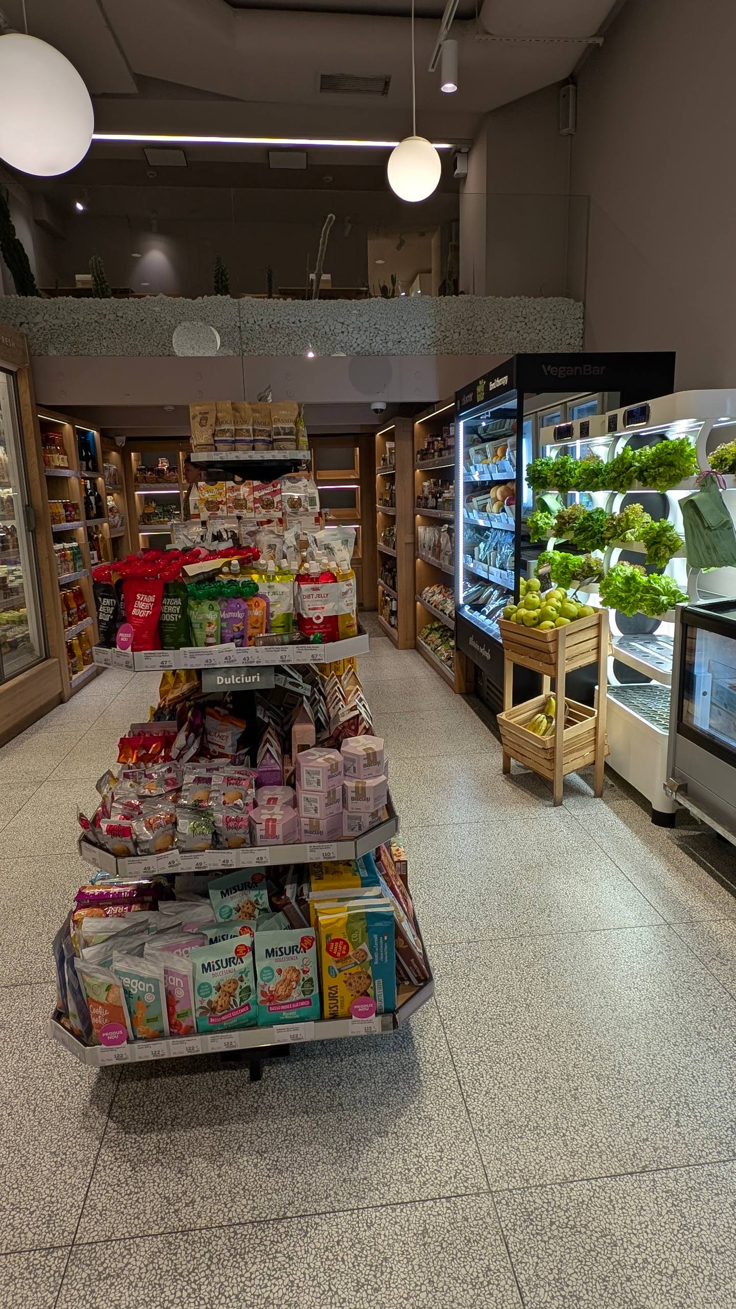 Modern convenience store interior with refrigerated displays and product shelves