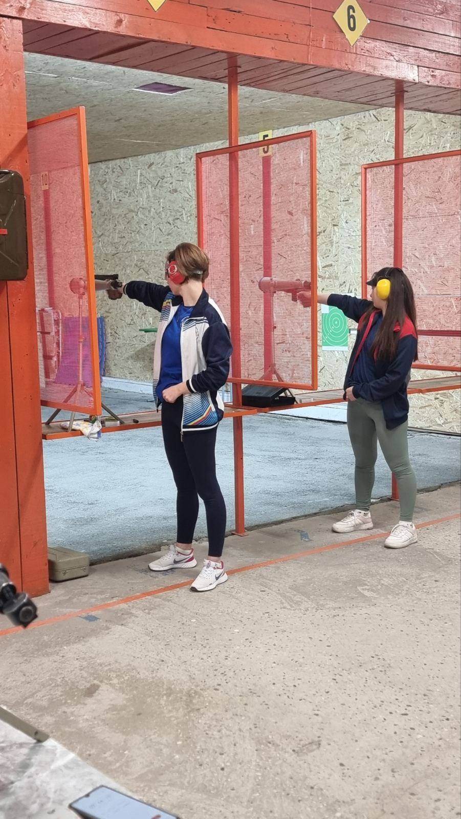 Shooting range with two participants at target stations