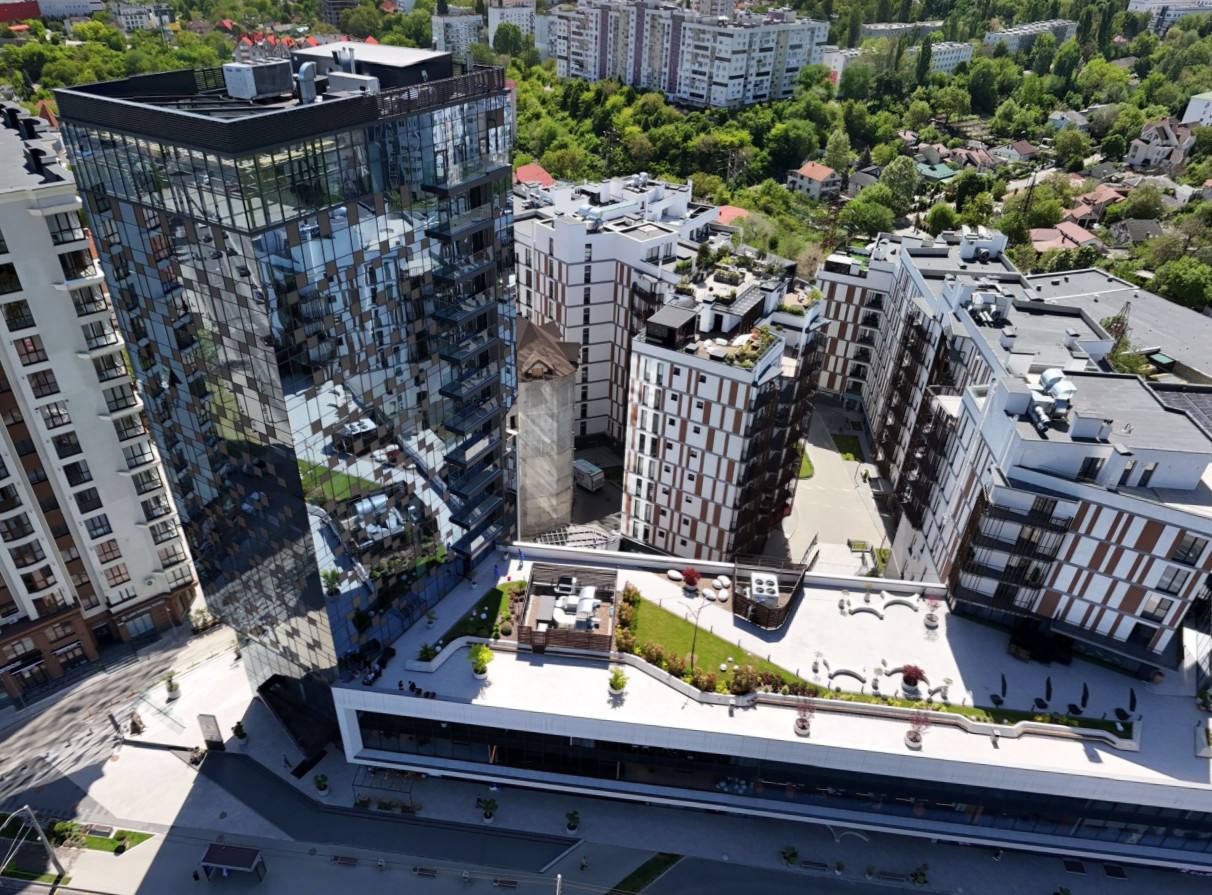 Aerial rooftop view of modern urban development with residential buildings