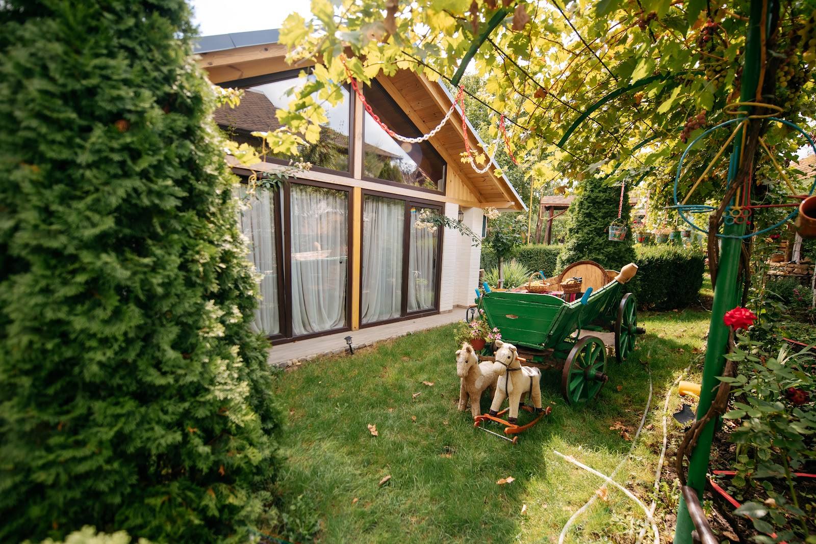 Modern glamping lodge with private garden terrace and seating area