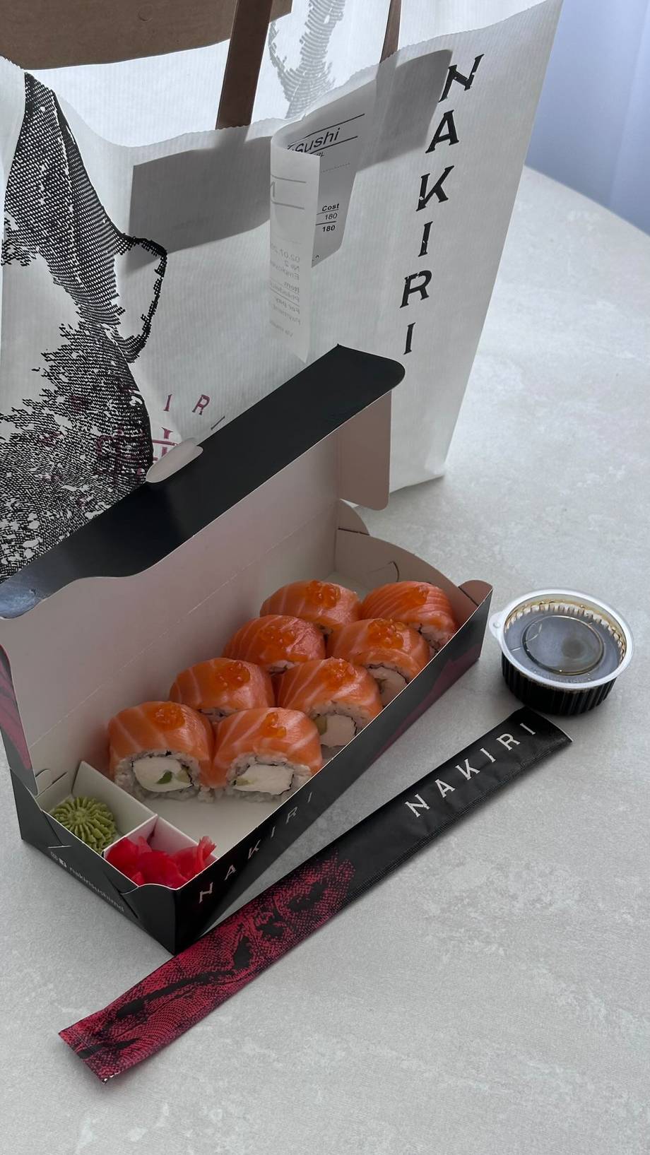 Makiri sushi rolls with branded packaging and dipping sauce