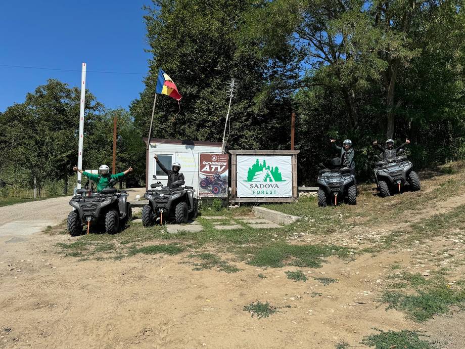 ATV quad bike rental station with vehicles and signage in outdoor park setting